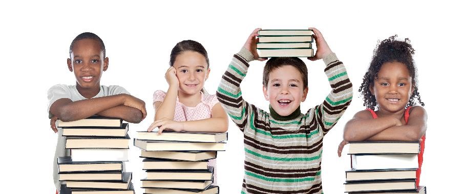 Four children of various ethnicities smiling and holding books.
