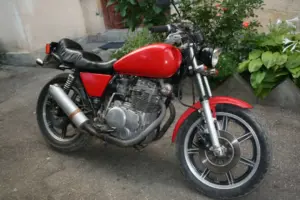 Vintage motorcycle in a driveway.